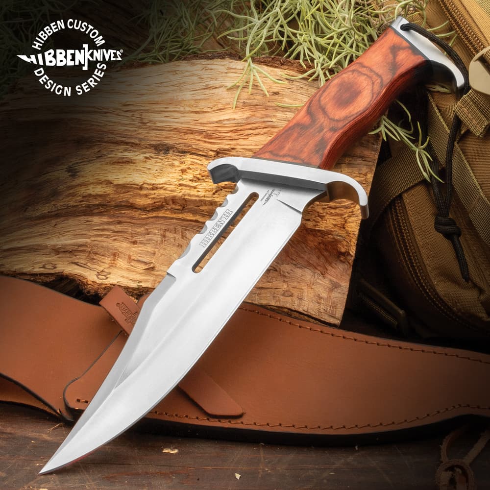 Gil Hibben 3 Knife Rambo Knife with polished, full tang blade with deep groove and serrated spine near the handle.Blades sharp curved edged handle Heavy-duty laminated wood handle image number 0