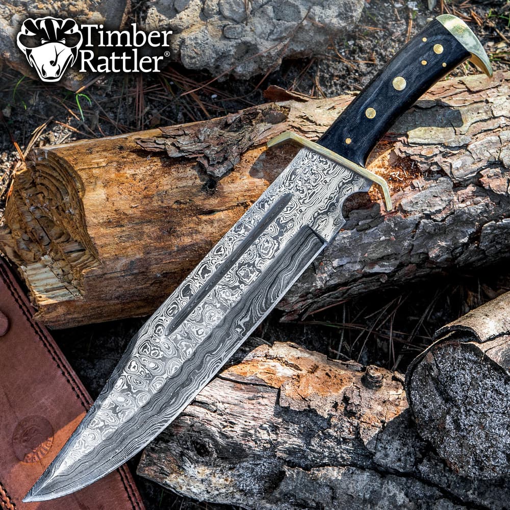 Damascus steel knife on wood logs with Timber Rattler logo image number 0