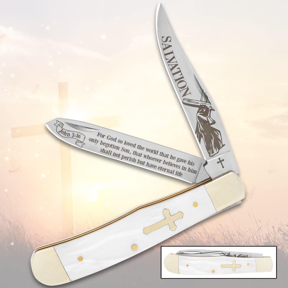 Pocket knife with religious engravings and cross handle image number 0