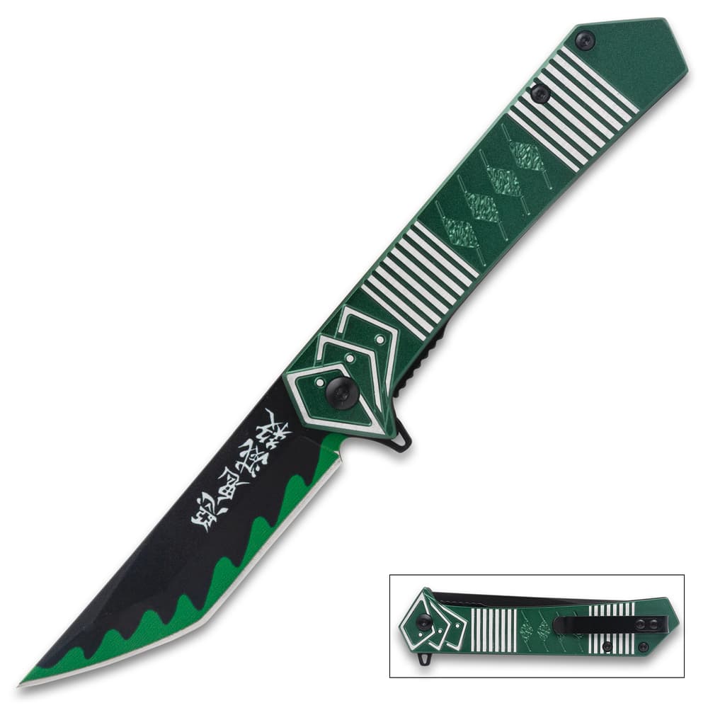 Green and black folding knife with geometric design image number 0