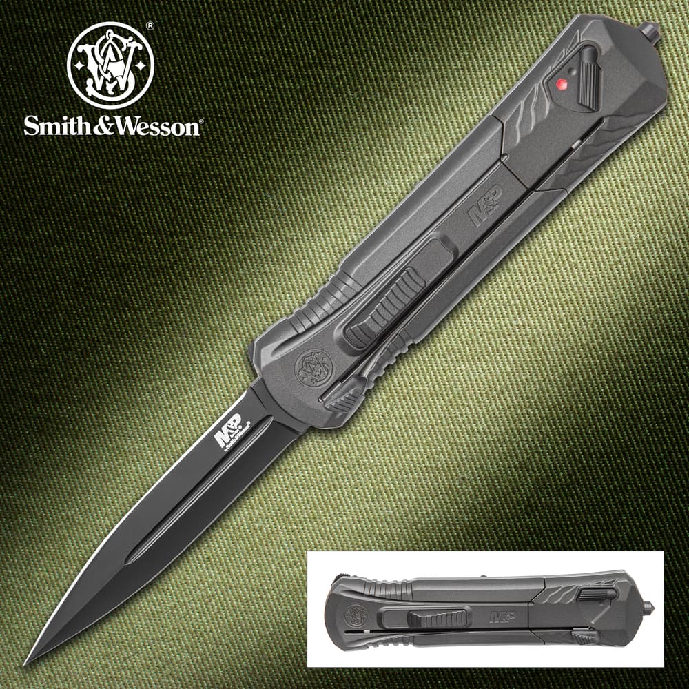 Smith & Wesson knife with open blade on textured background image number 0