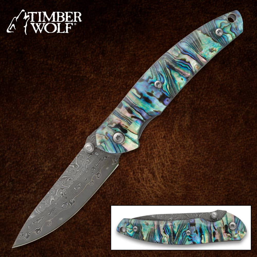 Colorful pocket knife with abalone handle and etched blade image number 0