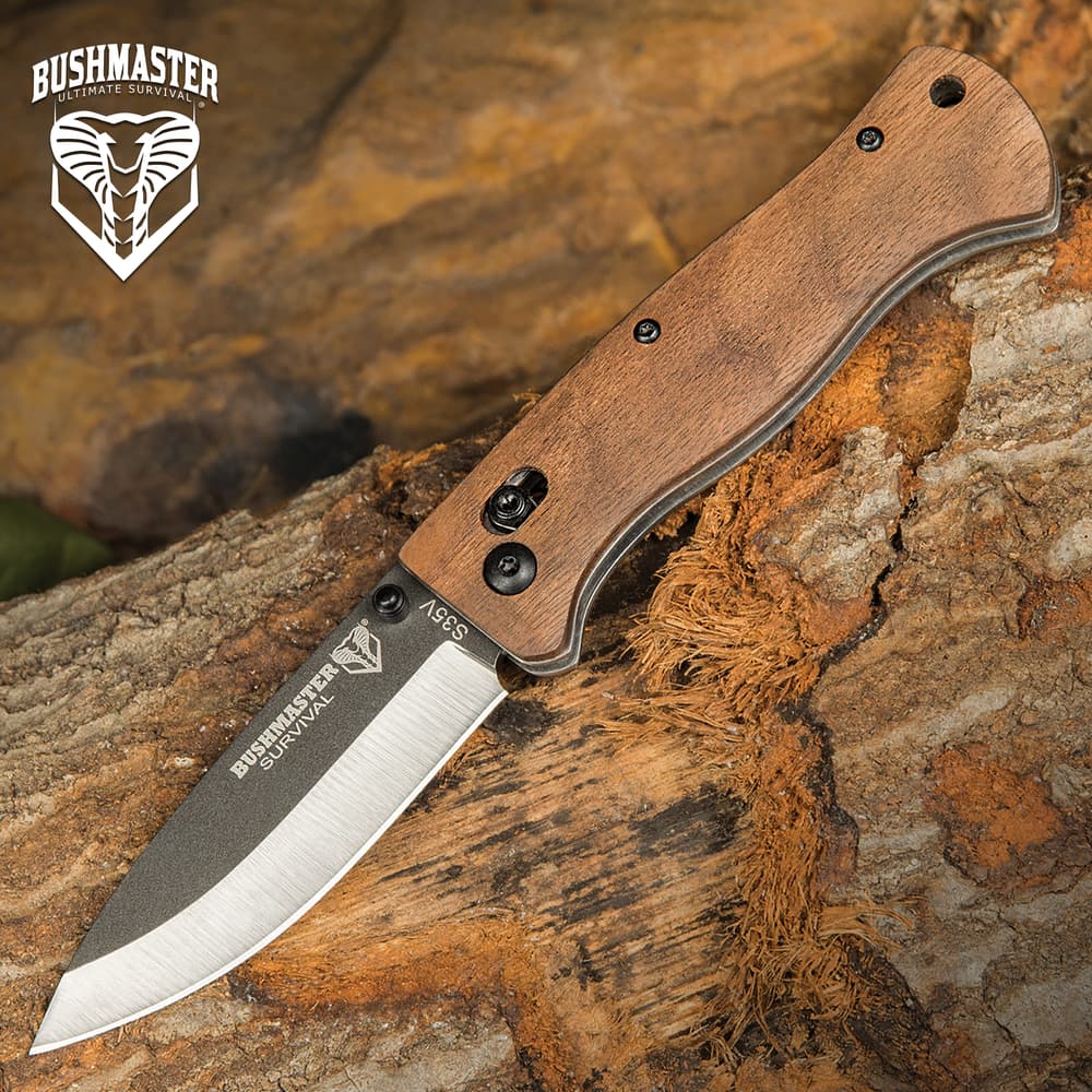 Hardness and durability are the hallmarks of the richly veined zebra wood used to craft the handle scales of the Bushmaster Bushcraft Explorer Pocket Knife image number 0