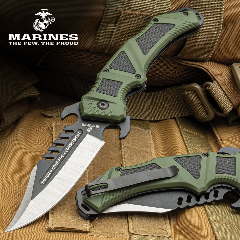 The USMC OD Green Pockeet Knife on display and another on in closed position showing the clip. image number 0