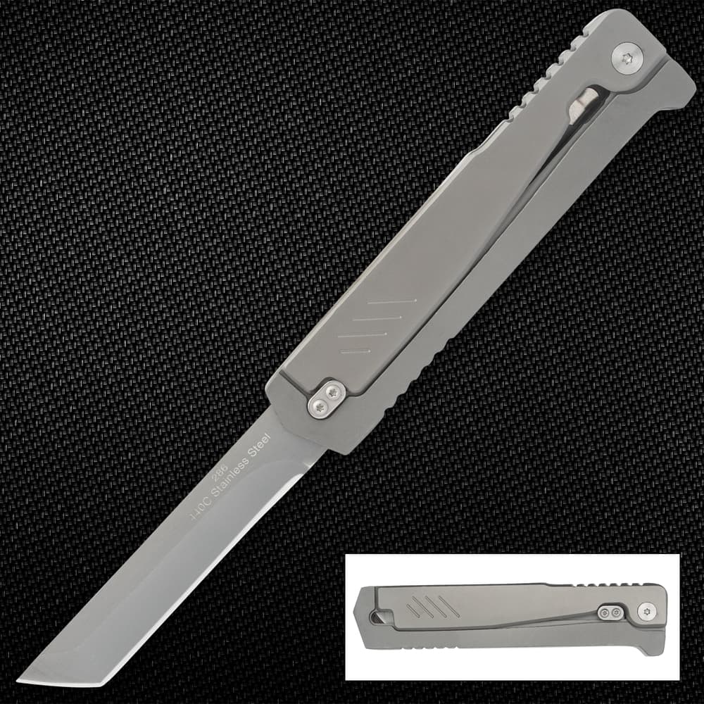 Stainless steel folding knife on textured background image number 0