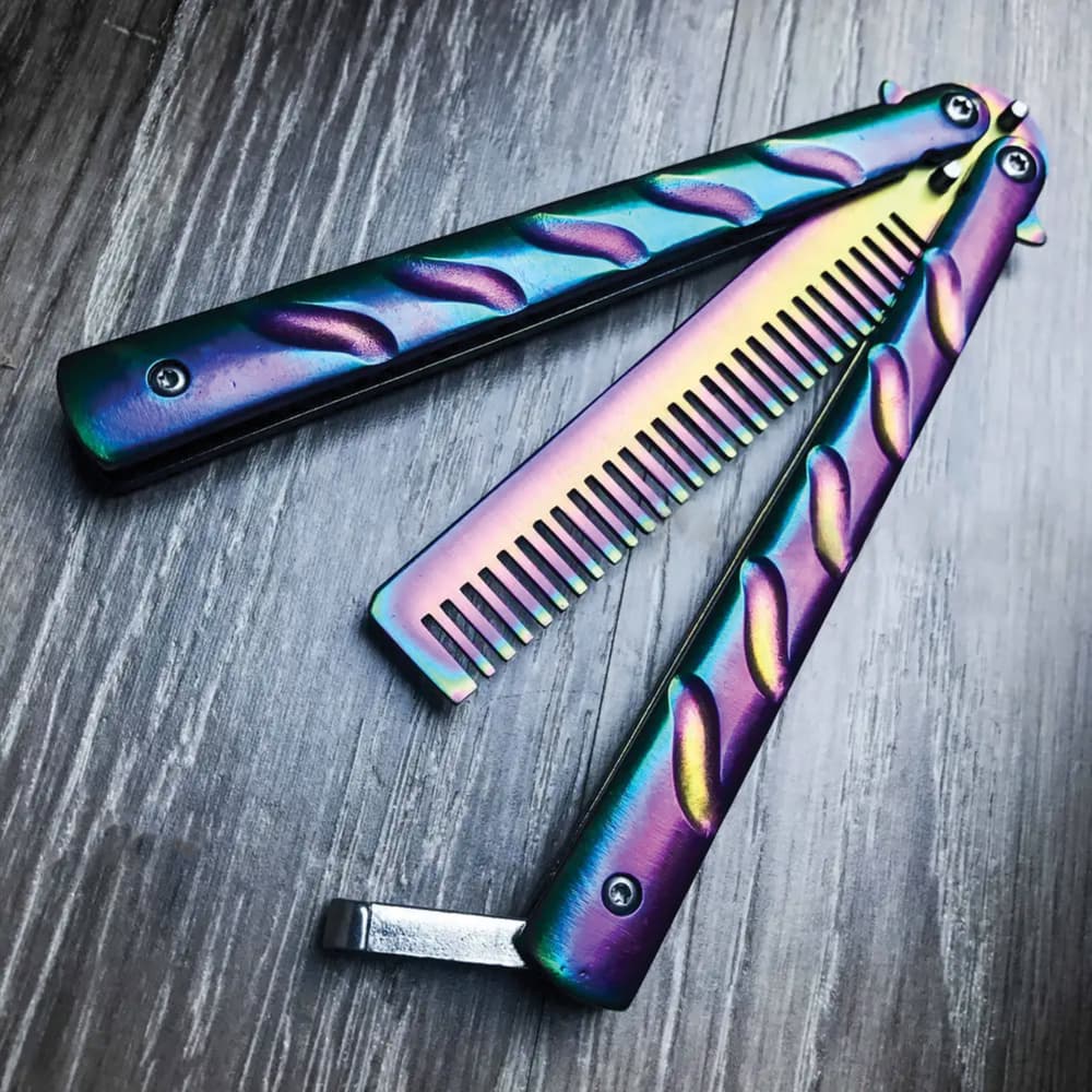 The Havoc Rainbow Butterfly Comb Trainer is constructed of 3Cr13 stainless steel with a rainbow finish and has a comb instead of a blade. image number 0