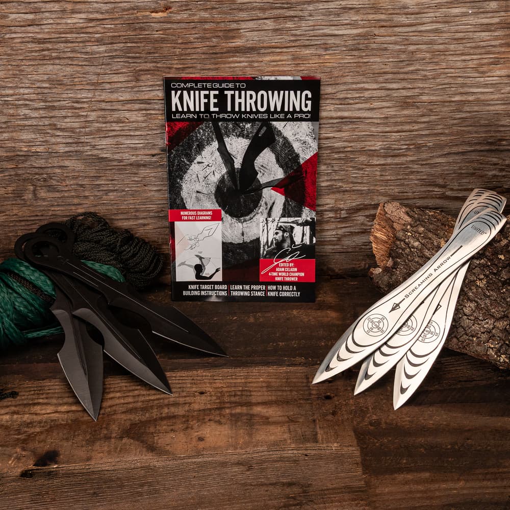 Knife throwing guide with black and white knives on wooden surface image number 0