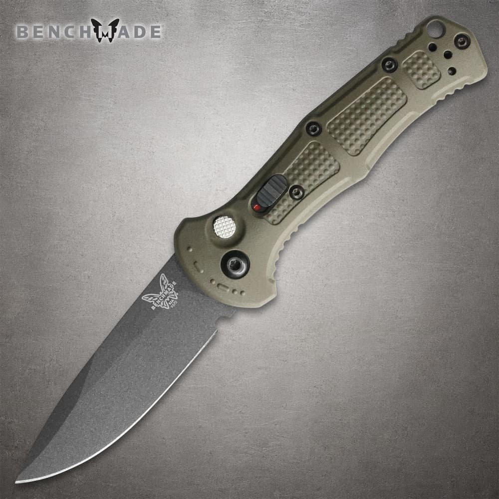 Olive green folding knife with textured handle image number 0