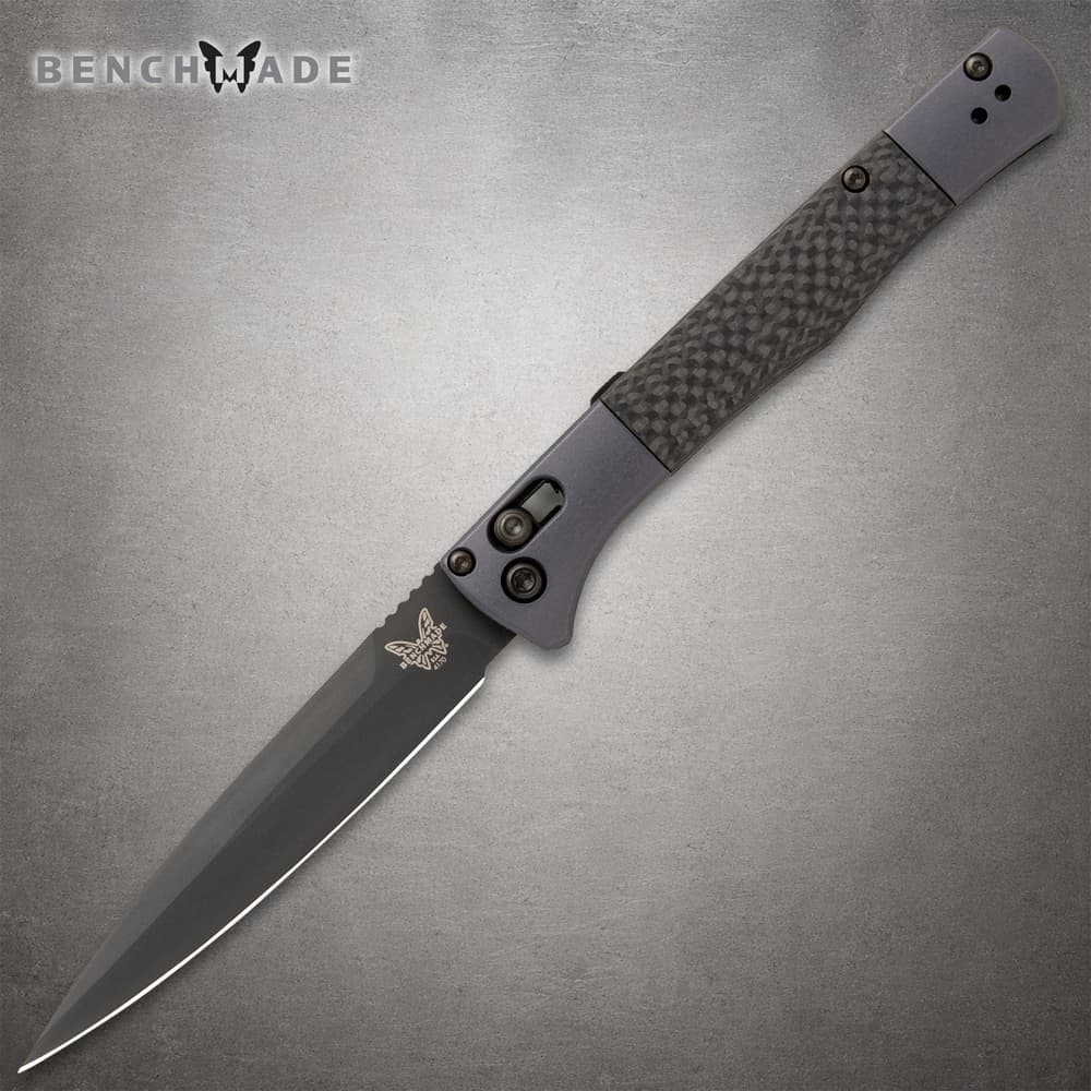 Sleek black folding knife with textured handle image number 0
