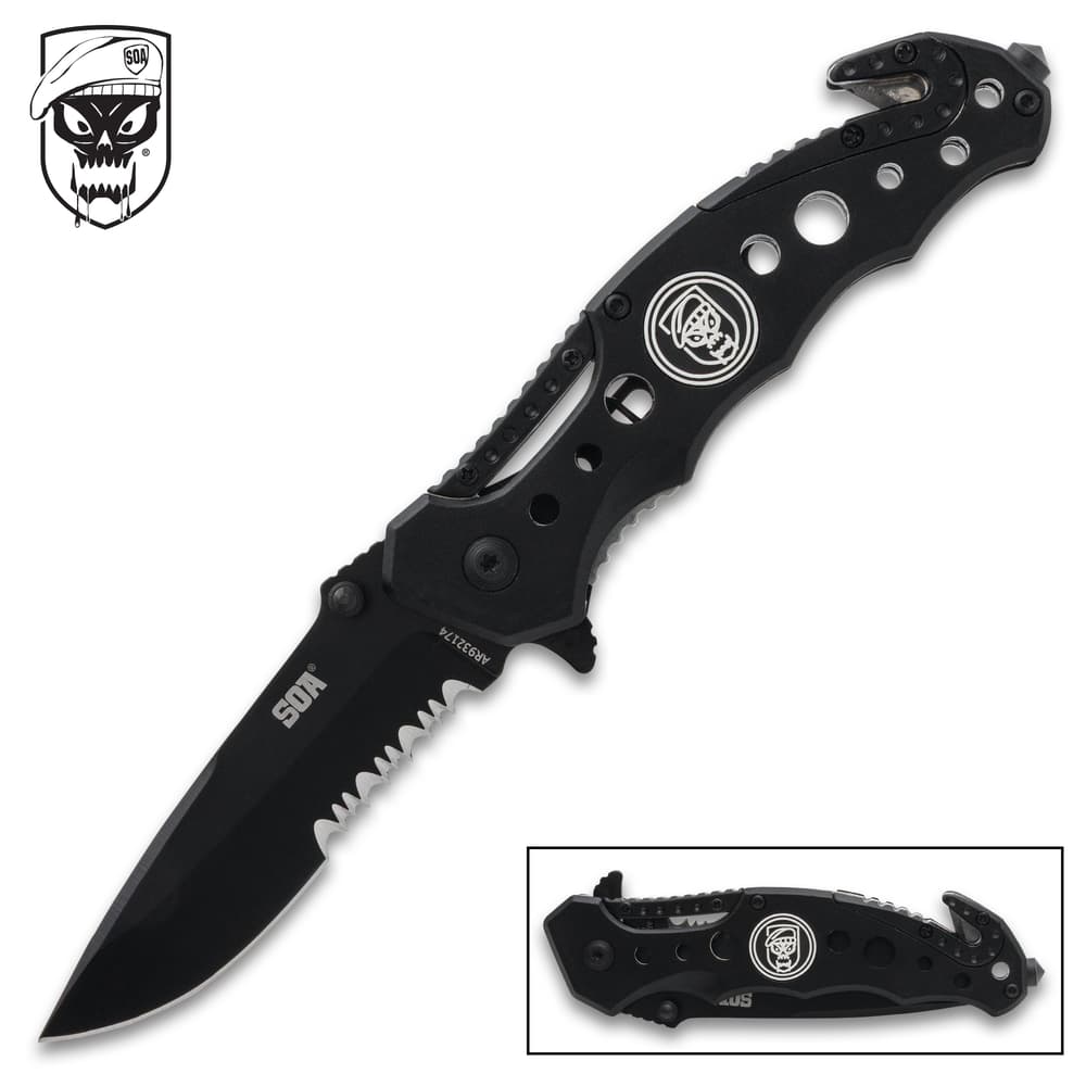 Black folding knife with skull logo and serrated blade image number 0