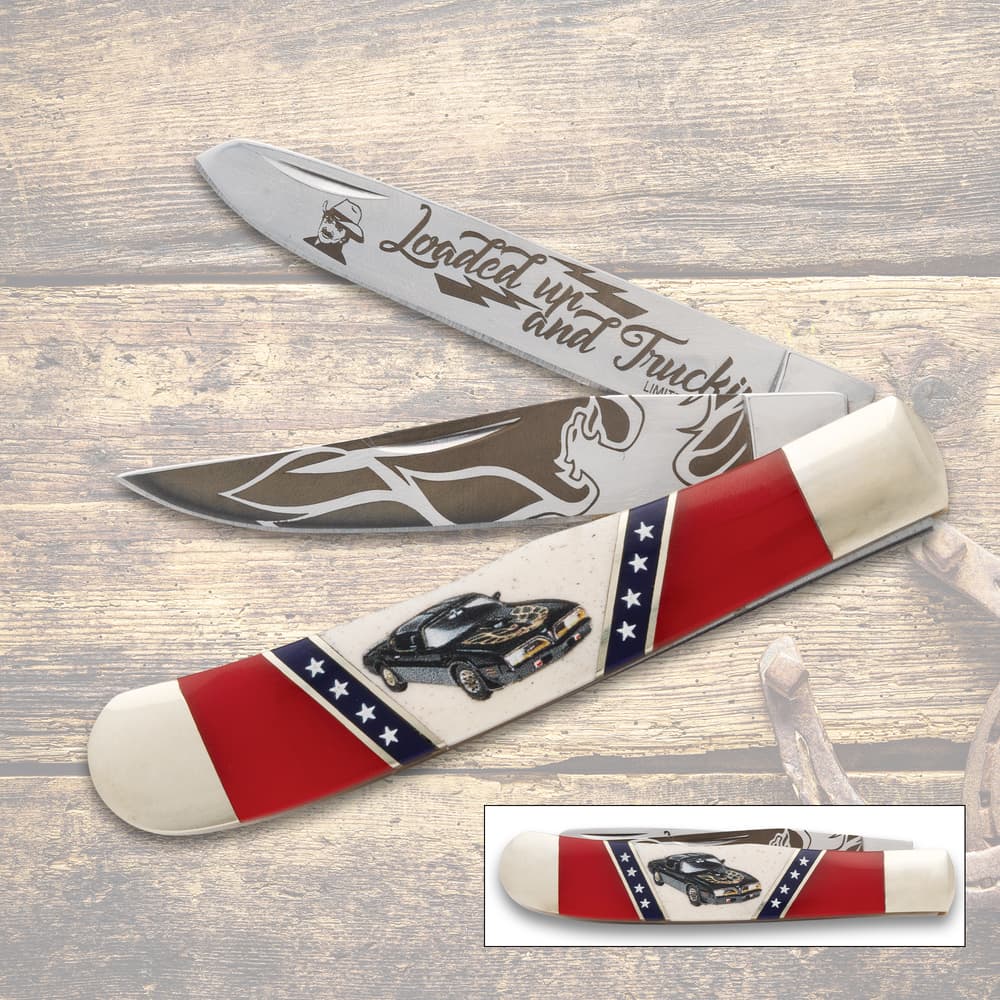 Folding knife with car design and red, white, blue handle image number 0