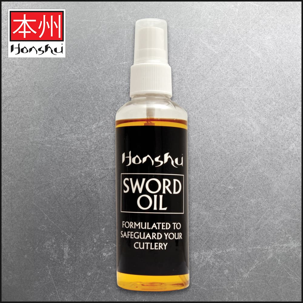 Honshu Sword Oil is shown in front of a Honshu blade on a background of wood. image number 0