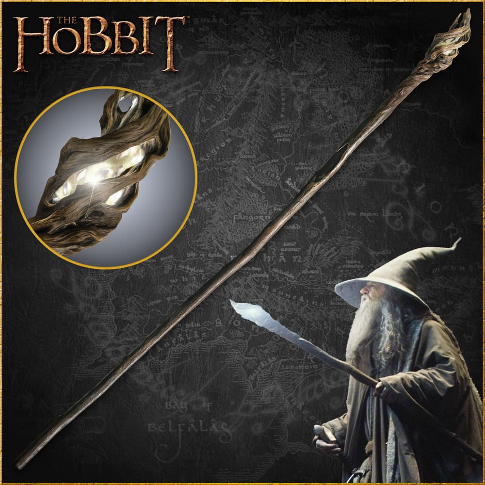 The Hobbit Staff of the Wizard Gandalf shown held by the character, in full, and with detailed look at the LED light at the end of the staff. image number 0