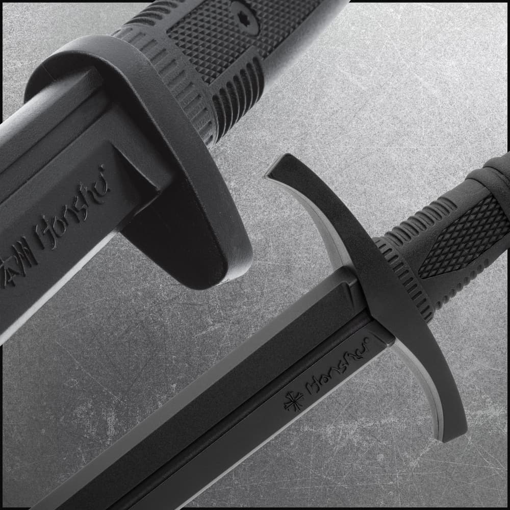 Close up image of the guard on the Training Sword and Training Dagger included in the Eastern Martial Arts Set. image number 1