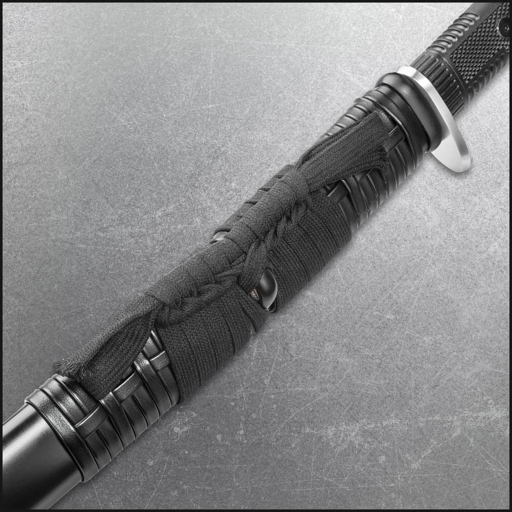 Close view of honshu katana sword encased in black leather sageo image number 1