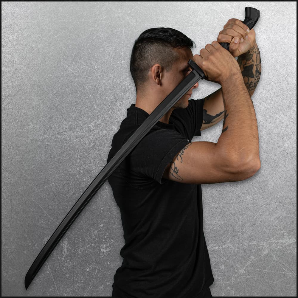 Full image of the Katana Training Sword included in the Eastern Martial Arts Set held in hand. image number 3