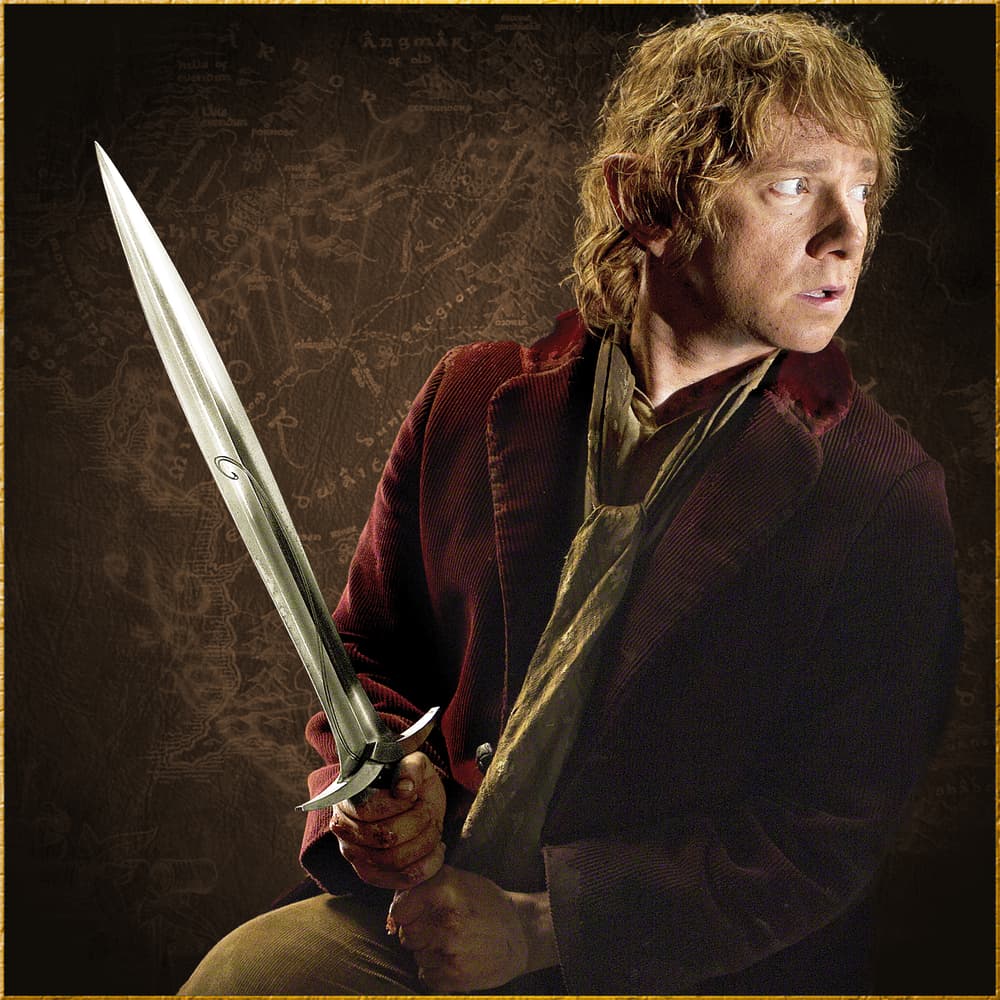 Full image of Bilbo Baggins holding the Sting Sword included in the Hobbit Bilbo Collection. image number 3