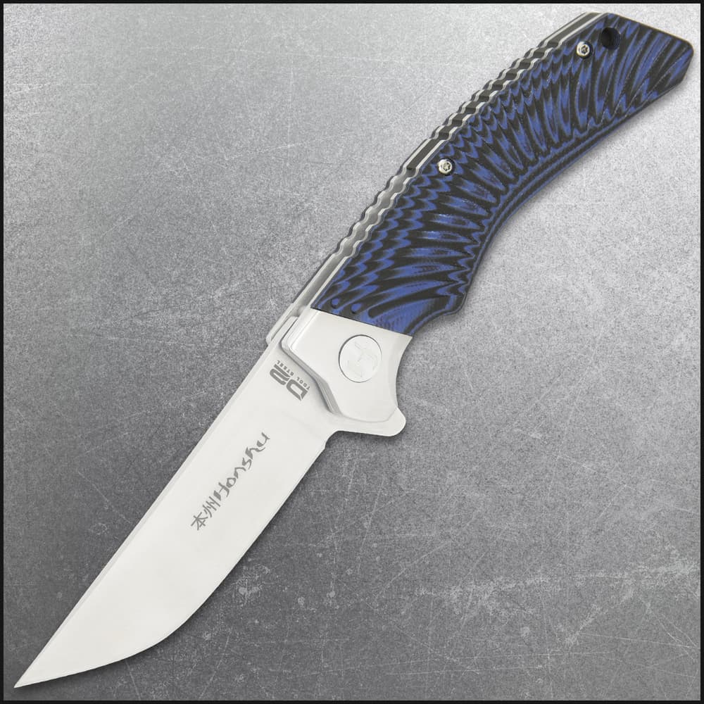 Angled view of extended pocket knife with a shining silver double edged blade and blue and black handle. image number 5