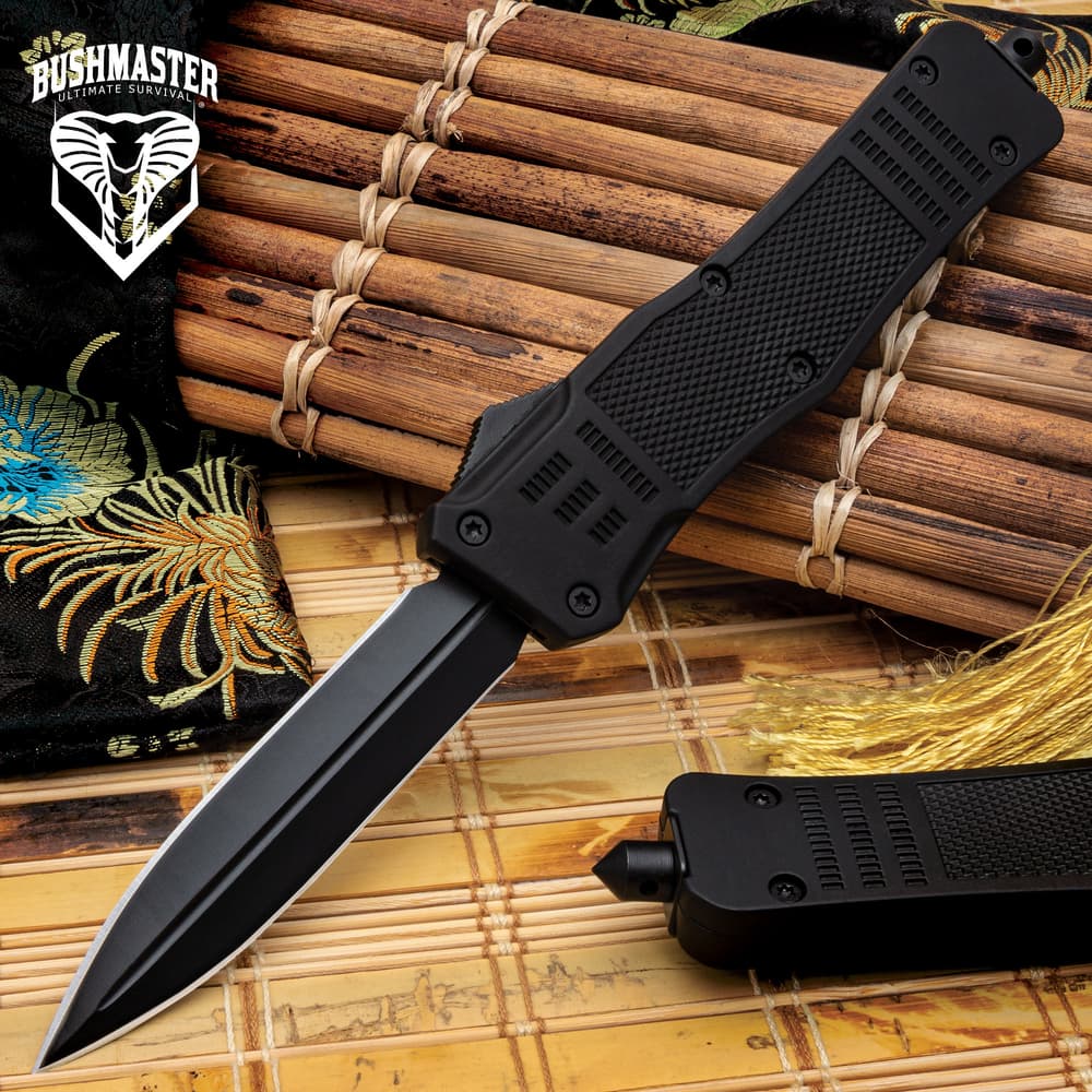 Bushmaster Mamba Automatic OTF Knife shown with stainless steel double-edged blade with black finish and textured TPU handle. image number 0