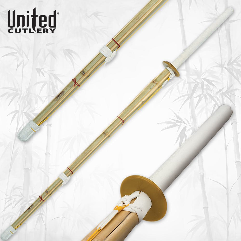 Bamboo shinai sword with white handle and guard on bamboo background image number 0