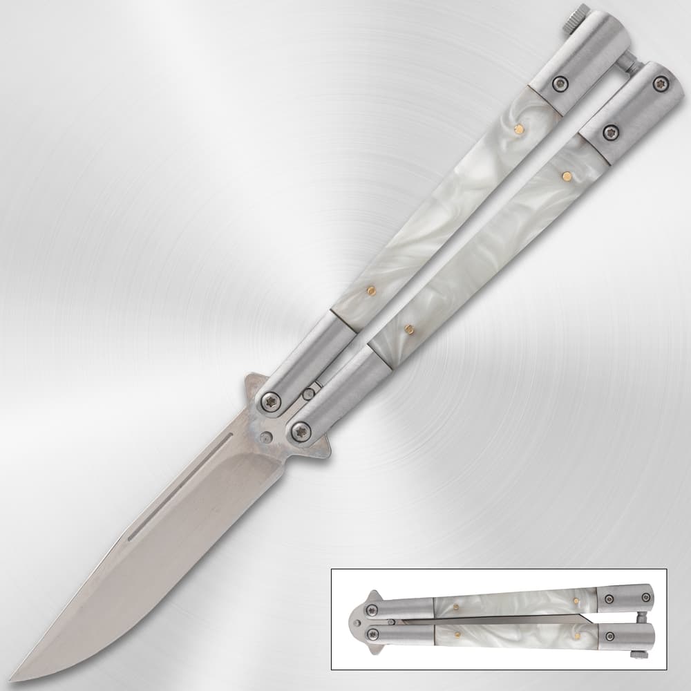 Butterfly knife with pearl handles on metallic background image number 0