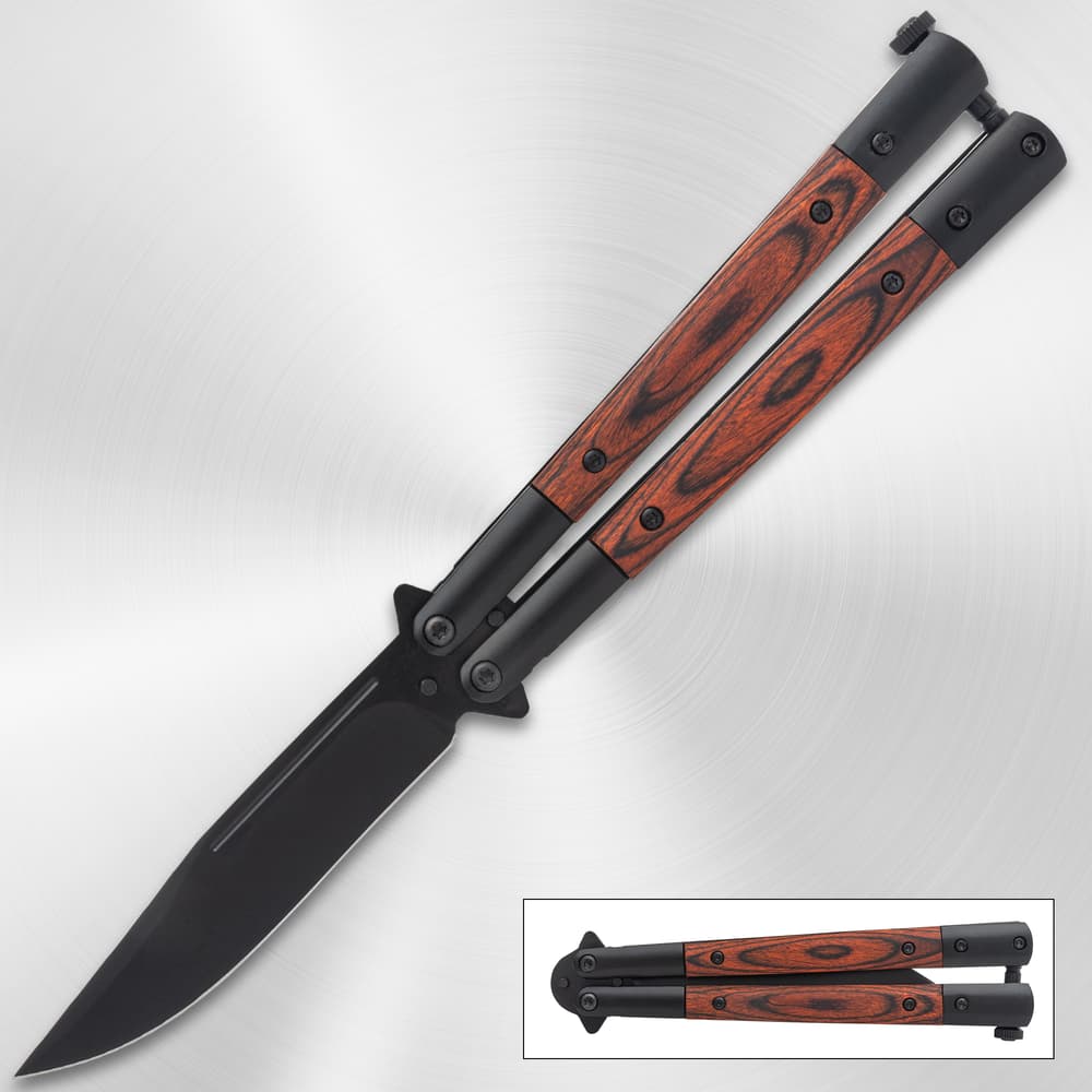 Butterfly knife with wood handle on metallic background image number 0