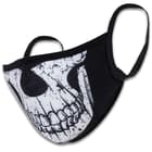 It features a unique, half skull printed design and ear loops on each end securely hold the black face mask in place
