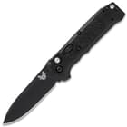 The automatic knife has a CPM-S30V steel drop point blade with a black finish