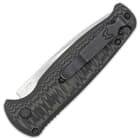 The lightweight handle has G10 handle scales and features an enlarged actuation button and a lanyard hole