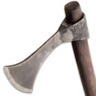 It has a rustic forge finished, 1065 high carbon steel head that’s 6 3/4”x 23” wide, with a razor- sharp 3 1/2” blade