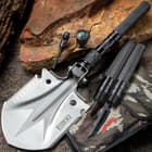 BugOut Multi-Function Folding Entrenchment Tool And Pouch - Shovel, Saw, Screw Drivers, Cord Cutter, Bottle Opener, Compass, Fire Striker
