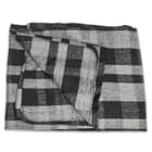 The 80 percent wool blanket measures 64" x 84" overall and weighs 4 lbs, adding insulation, especially, when you’re camping