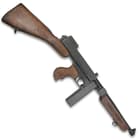 It has a metal and wood construction and features a working bolt action and trigger and includes a removable stick clip
