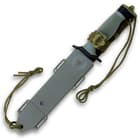 The knife is housed in a reinforced multifunctional sheath.