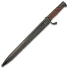The 19 1/4” overall length bayonet slides securely into an 18-gauge, black metal scabbard