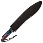 The patriotic machete is 25” in overall length features a wrist lanyard, and comes in a nylon belt sheath with a shoulder sling