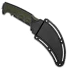 The 8 7/10” overall karambit knife snaps securely into a hard plastic belt clip sheath, which features lashing holes