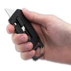 The utility blade can be deployed with a slide trigger\