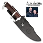 The fixed blade is 12 1/2” in overall length and fits like a glove in its included leather belt sheath