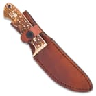 The Schrade Uncle Henry Elk Hunter Skinner Knife can be easily carried in its leather belt sheath