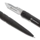 smith & wesson ink pen pocket knife has a blade at one end and an ink pen at the other end