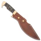 The 16 1/2” overall kukri knife slides smoothly into a genuine leather belt sheath, accented with white top-stitching and brass snaps