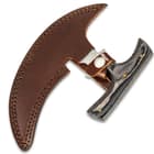 The ulu is shown secured into its custom premium leather belt sheath with snap closure.