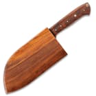 The butcher knife is securely stored in its premium wooden sheath.