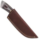 The fixed blade knife is 9 1/4” in overall length and slides securely into a premium leather belt sheath for ease of carry