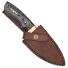 The 9” skinner knife can be stored and carried in its genuine, premium leather belt sheath, which has a snap strap closure
