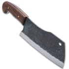 The carbon steel cleaver blade has a rough-forged finish.