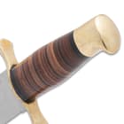 The handle is stacked leather with a brass pommel.