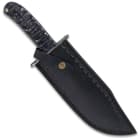 The fixed blade knife in its sheath