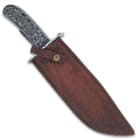 The fixed blade in its leather sheath
